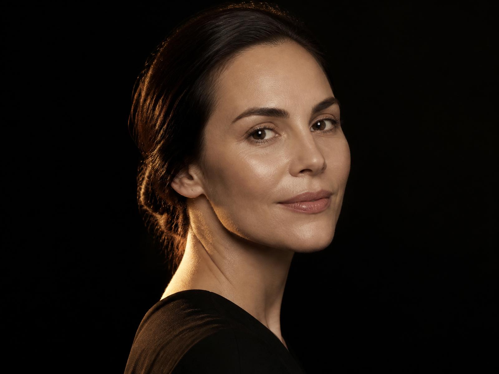Editorial portrait of a woman with healthy, natural skin